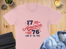 Load image into Gallery viewer, Pink t-shirt with "1776 America Land of the Free" text in red and blue.