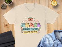 Load image into Gallery viewer, Cream t-shirt with "I became a NURSE because your life is worth my time" text.