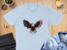 Load image into Gallery viewer, Light blue t-shirt featuring an eagle with wings made of the American flag.