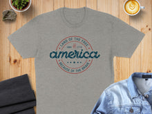 Load image into Gallery viewer, Gray t-shirt with "America" and patriotic text in a circular badge.