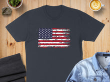 Load image into Gallery viewer, Distressed American flag graphic on a dark grey t-shirt.