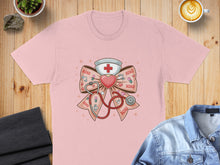Load image into Gallery viewer, Pink t-shirt with a stethoscope, heart, and XOXO bow graphic.