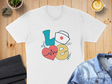 Load image into Gallery viewer, White t-shirt with "Love" spelled out in medical icons: heart, stethoscope, nurse cap.