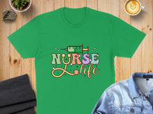 Load image into Gallery viewer, Green t-shirt with "Nurse Life" text and syringe graphic.