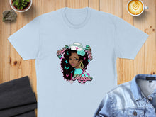 Load image into Gallery viewer, Light blue t-shirt with Black Girl Magic nurse graphic and butterflies.