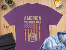 Load image into Gallery viewer, Purple t-shirt with "America Victory Day" and a distressed US flag design.