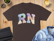 Load image into Gallery viewer, Brown t-shirt with "RN" in a patchwork quilt design.