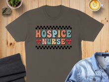 Load image into Gallery viewer, Hospice Nurse text with heart and heartbeat graphic on a dark t-shirt.