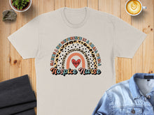 Load image into Gallery viewer, T-shirt with rainbow design and "Hospice Nurse" text.