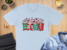 Load image into Gallery viewer, Light blue t-shirt with graphic of four nurse-themed coffee drinks.