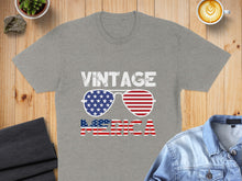 Load image into Gallery viewer, Gray t-shirt with "VINTAGE AMERICA" text and American flag sunglasses.