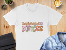 Load image into Gallery viewer, White t-shirt with "Registered Nurse" text in colorful retro font with floral accents.