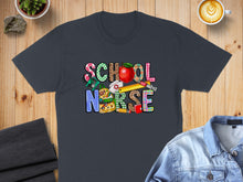 Load image into Gallery viewer, Dark grey t-shirt with "School Nurse" text in colorful, school-themed graphics.