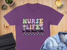Load image into Gallery viewer, Purple t-shirt with colorful "Nurse Life Is The Best Life" text and floral accents.