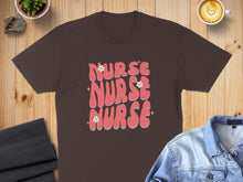 Load image into Gallery viewer, Brown t-shirt with "Nurse" text in pink, three times, with flowers.