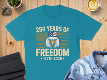 Load image into Gallery viewer, Teal t-shirt with eagle, flag bandana, and "250 Years of Freedom 1776-2026" text.