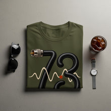 Load image into Gallery viewer, Olive green t-shirt with black cable art forming the number 73 and a waveform.