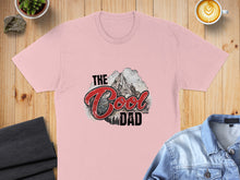 Load image into Gallery viewer, Pink t-shirt with "The Cool Dad" text and mountain graphic.