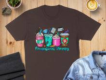 Load image into Gallery viewer, Brown t-shirt with colorful occupational therapy themed drinks and text.