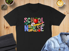 Load image into Gallery viewer, Black t-shirt with "SCHOOL NURSE" text featuring school supply graphics.