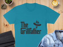 Load image into Gallery viewer, Teal t-shirt with "The Grillfather" text and a fork with flame graphic.