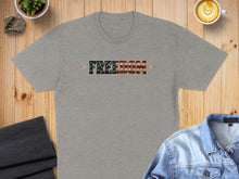 Load image into Gallery viewer, Grey t-shirt with "FREEDOM" text in American flag design.