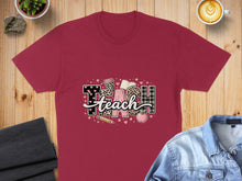 Load image into Gallery viewer, Maroon t-shirt with "Teach" graphic featuring books, pencil, apple, and leopard print.