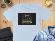 Load image into Gallery viewer, Light blue t-shirt with "Est. 1776 Independence Day" graphic.