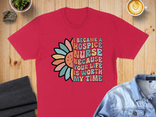 Load image into Gallery viewer, Red t-shirt with colorful floral text: "I became a hospice nurse because your life is worth my time".