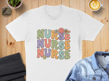 Load image into Gallery viewer, White t-shirt with "Nurse Nurse Nurse" text and floral accents.