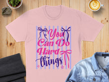 Load image into Gallery viewer, Pink t-shirt with "You Can Do Hard Things" text and bow graphics.