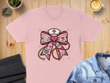 Load image into Gallery viewer, Pink t-shirt with a nurse-themed bow graphic, featuring hearts, stethoscopes, and "XOXO".