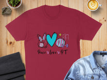 Load image into Gallery viewer, Burgundy t-shirt with "Peace Love PT" design featuring a peace sign, heart, and physiotherapy equipment.