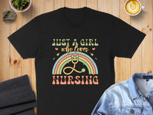 Load image into Gallery viewer, Black t-shirt with "Just a girl who loves nursing" text and rainbow stethoscope graphic.