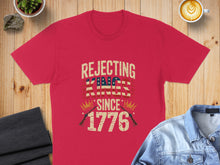 Load image into Gallery viewer, Red t-shirt with "Rejecting Kings Since 1776" text and American flag elements.