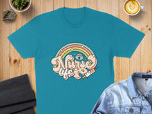 Load image into Gallery viewer, Teal t-shirt with "Nurse Life" rainbow and syringe graphic.