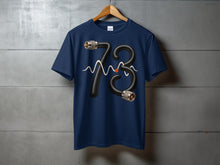 Load image into Gallery viewer, Dark blue t-shirt with a black cable forming the number 73 and a subtle waveform.
