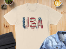Load image into Gallery viewer, Cream t-shirt with distressed "USA" text in American flag pattern.