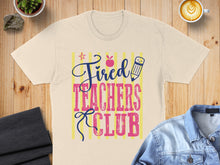 Load image into Gallery viewer, Cream t-shirt with "Tired Teachers Club" text and cartoon pencil.