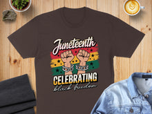 Load image into Gallery viewer, Juneteenth t-shirt with hands holding chains, celebrating black freedom.