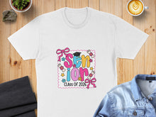 Load image into Gallery viewer, White t-shirt with "Senior Class of 2026" design featuring diplomas and bows.