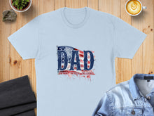 Load image into Gallery viewer, Light blue t-shirt with "DAD" in American flag design and watercolor splashes.