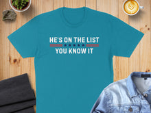 Load image into Gallery viewer, Teal t-shirt with white text: HE'S ON THE LIST YOU KNOW IT.
