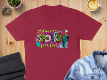 Load image into Gallery viewer, Burgundy t-shirt with "One Spooky Nurse" Halloween graphic featuring syringes and a tombstone.