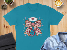 Load image into Gallery viewer, Teal t-shirt with a nurse's cap, stethoscope, and heart-shaped bow graphic.