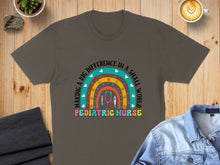 Load image into Gallery viewer, T-shirt graphic with rainbow and stethoscope reading "Making a Big Difference in a Small World Pediatric Nurse".