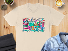 Load image into Gallery viewer, Cream t-shirt with "LVN Licensed Vocational Nurse" and various medical and coffee-themed graphics.