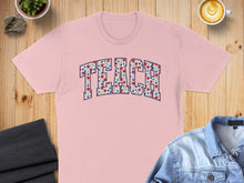 Load image into Gallery viewer, Pink t-shirt with "TEACH" in a floral pattern.