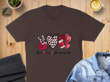 Load image into Gallery viewer, Brown t-shirt with peace sign, heart, and pharmacy symbols.