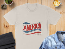 Load image into Gallery viewer, Cream t-shirt with distressed "AMERICA" text, stars, and red, white, blue stripes.